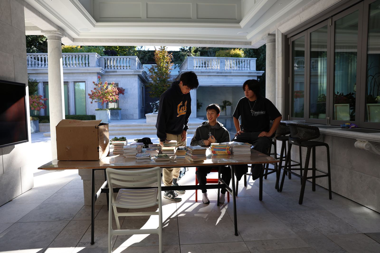 Volunteers sorting donated books at a collection table