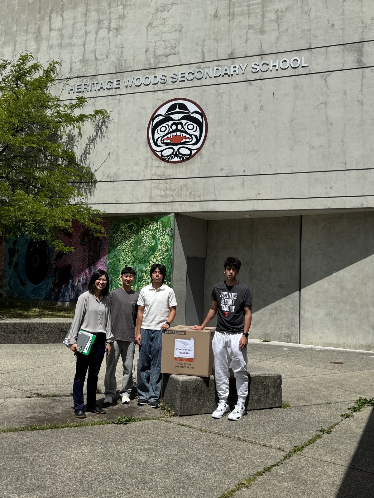 The FSF team with a donation box outside Heritage Woods Secondary School