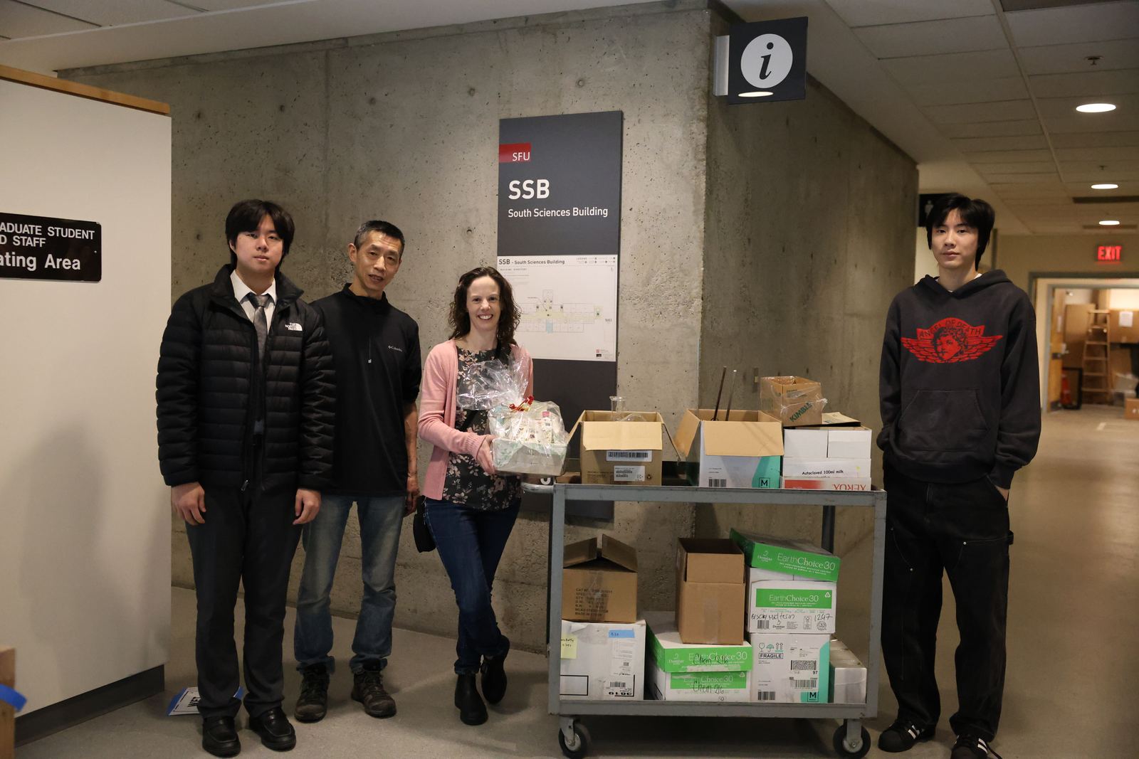 The team collecting carts of surplus glassware at Simon Fraser University