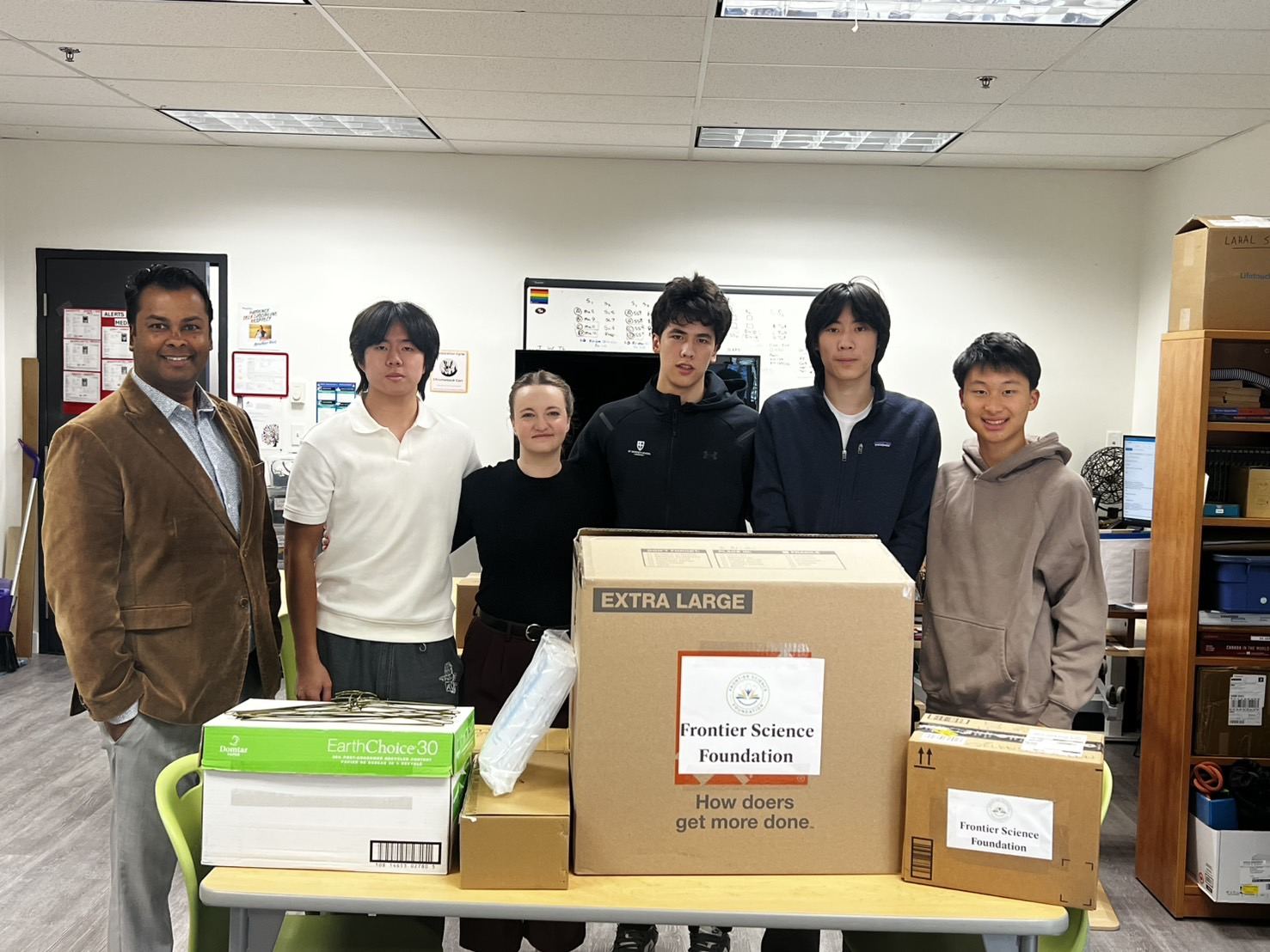 The Frontier Science Foundation team with boxes of equipment ready for donation