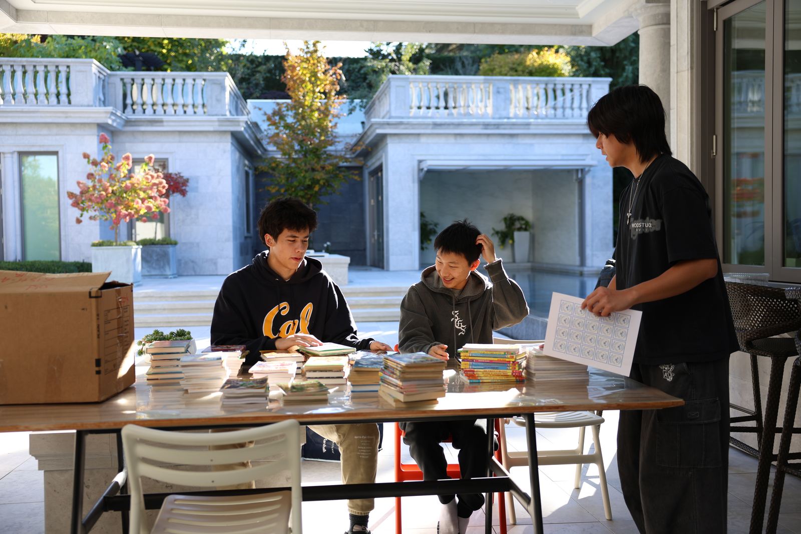 Volunteer team working together at a book drive table